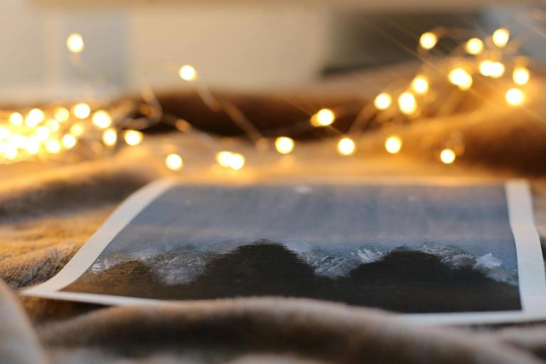 photo of mountain near string lights